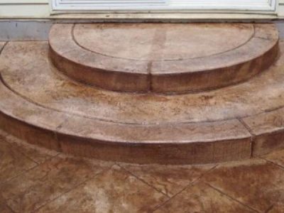 A patio with steps and a door.