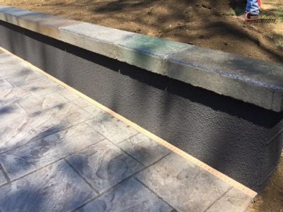 A concrete slab with a black strip on it